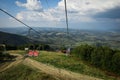 Empty chairlift on a background of beautiful autumn mountains Royalty Free Stock Photo