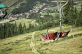 Empty chairlift on a background of beautiful autumn mountains Royalty Free Stock Photo