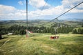 Empty chairlift on a background of beautiful autumn mountains Royalty Free Stock Photo