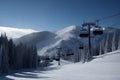 An empty chairlift on a background of snowy slopes and blue sky. Winter landscape of the ski resort. Winter sports during the