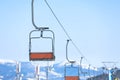 Empty chairlift at mountain ski resort. Winter vacation Royalty Free Stock Photo