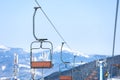 Empty chairlift at mountain ski resort. Winter vacation Royalty Free Stock Photo