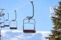 Empty chairlift at mountain ski resort Royalty Free Stock Photo