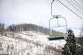 Empty chairlift at mountain ski resort. Winter vacation Royalty Free Stock Photo