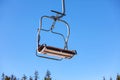 Empty chairlift at mountain ski resort. Winter vacation Royalty Free Stock Photo