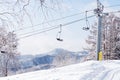 An empty chairlift at ski resort Royalty Free Stock Photo