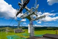 Empty chairlift in ski resort. Shot in summer with green grass a Royalty Free Stock Photo