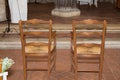 Two empty chairs in church before wedding celebration Royalty Free Stock Photo