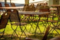 Empty chairs and desks of a garden restaurant Royalty Free Stock Photo