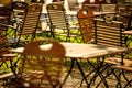 Empty chairs and desks of a garden restaurant Royalty Free Stock Photo