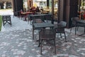 Empty modern chairs in outdoor cafe or restaurant on summer day. Reastaurant tables waiting for customers Royalty Free Stock Photo