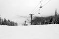 Empty chairs on the ski lift in winter Royalty Free Stock Photo