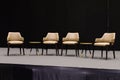 Empty chairs on stage ready for seminar