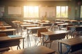 Empty chairs and tables in a school classroom with sunlight in the morning Royalty Free Stock Photo