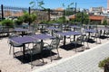 Empty chairs and tables of a traditional restaurant in the touristic district of Plaka Royalty Free Stock Photo