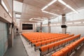 Empty chairs in theatre or conference hall. Orange color Royalty Free Stock Photo