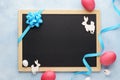 Empty chalkboard and easter decoration with bunny and pink eggs