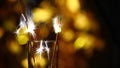 Empty champagne glass Bengalese candle gold bokeh