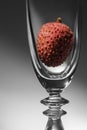 Empty champagne glass with lychee