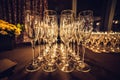 Empty champagne glasses in row on evening event party waiting for the guests.