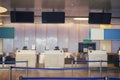 Empty check-in counters with electronic boards at the airport Royalty Free Stock Photo