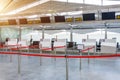 Empty Check-in Desks For Drop Off Baggage With Paths Canceled With A Red Ribbon To Differentiate Passengers At The Airport