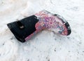 An empty child`s winter boot lying on snow Royalty Free Stock Photo