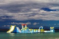 Empty children attraction in the sea, stormy weather on the beach