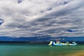 Empty children attraction in the sea, stormy weather on the beach