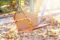 Empty children`s swing in autumn park at sunset Royalty Free Stock Photo