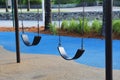 An empty children\'s swing at the playground in Miami Beach, USA Royalty Free Stock Photo