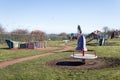 Empty childs playground in enclosed park area in residential area.  Various climbing frames and structures visible Royalty Free Stock Photo