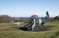 Empty childs playground in enclosed park area in residential area.  Various climbing frames and structures visible Royalty Free Stock Photo