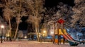 Empty childs playground at night in town Royalty Free Stock Photo