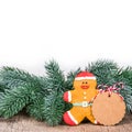 Empty christmas tag. Gingerbread man and fir branches. Royalty Free Stock Photo