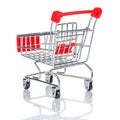 Empty chromed toy market shopping cart with red handle and plastic board on the front. Rear view on white background with Royalty Free Stock Photo