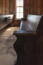 Empty Wooden Church Pew In Vertical Orientation Royalty Free Stock Photo