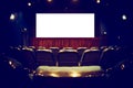 Empty cinema auditorium with empty white screen. Empty rows of theater or movie seats. Toned