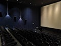 Empty cinema hall with dark chairs Royalty Free Stock Photo