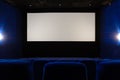 View of empty white cinema screen from the upper rows of the auditorium Royalty Free Stock Photo