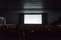 Empty cinema screen with audience