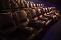 Empty cinema, cinema with soft chairs before the premiere of the film. There are no people in the cinema. Sliding automatic comfor Royalty Free Stock Photo