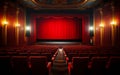 Empty cinema theater with red seats curtains and a blank white screen ready for the audience to enjoy a movie Royalty Free Stock Photo