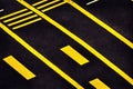 Empty city asphalt road background with pedestrian crossing under traffic lights closeup directly above view. Urban