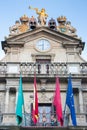 Empty city hall with flags in Pamplona. Famous square in centre of Pamplona. Exterior of ancient medieval town hall.