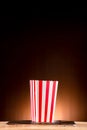 Empty classic red and white paper striped bucket for popcorn. Empty box for Popcorn or Fries or Chicken Legs to red with white.  p Royalty Free Stock Photo