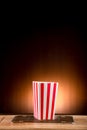 Empty classic red and white paper striped bucket for popcorn. Empty box for Popcorn or Fries or Chicken Legs to red with white.  p Royalty Free Stock Photo