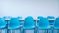 Empty Classroom with Blue Chairs and White Walls in a Minimalist Setting Royalty Free Stock Photo