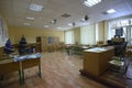 Empty classroom of a school: desks, teacher`s drawer, decorated Christmas trees