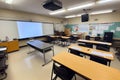 empty classroom setup with smartboard, projector, and laptop for modern learning Royalty Free Stock Photo